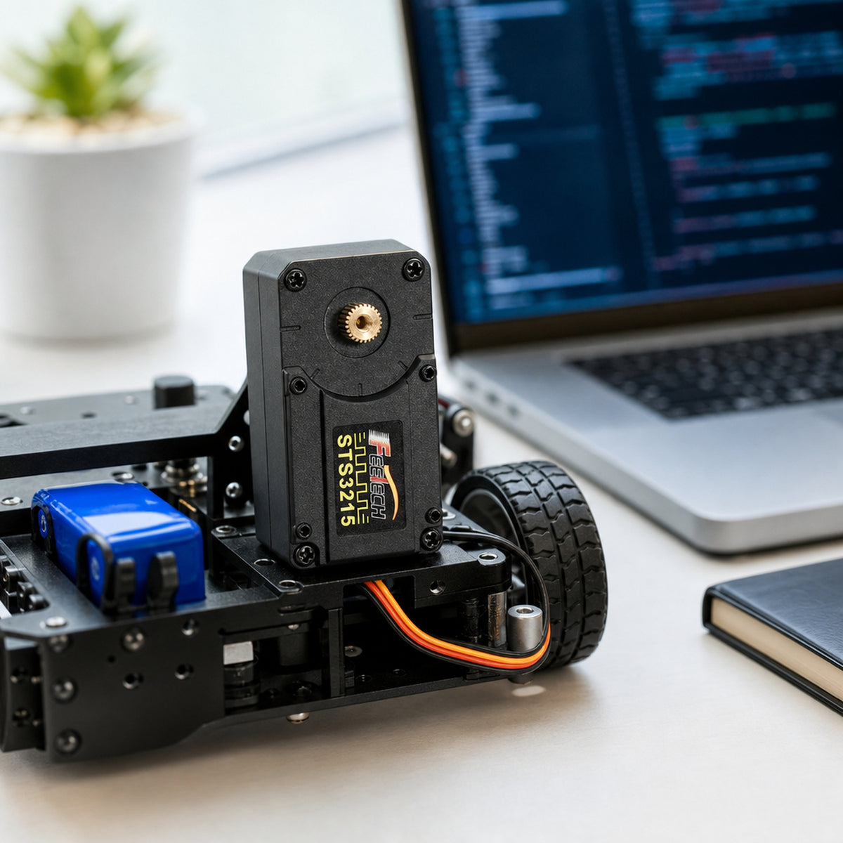 Feetech STS3215 bus servo – the servo installed inside a small wheeled robot chassis on a desk