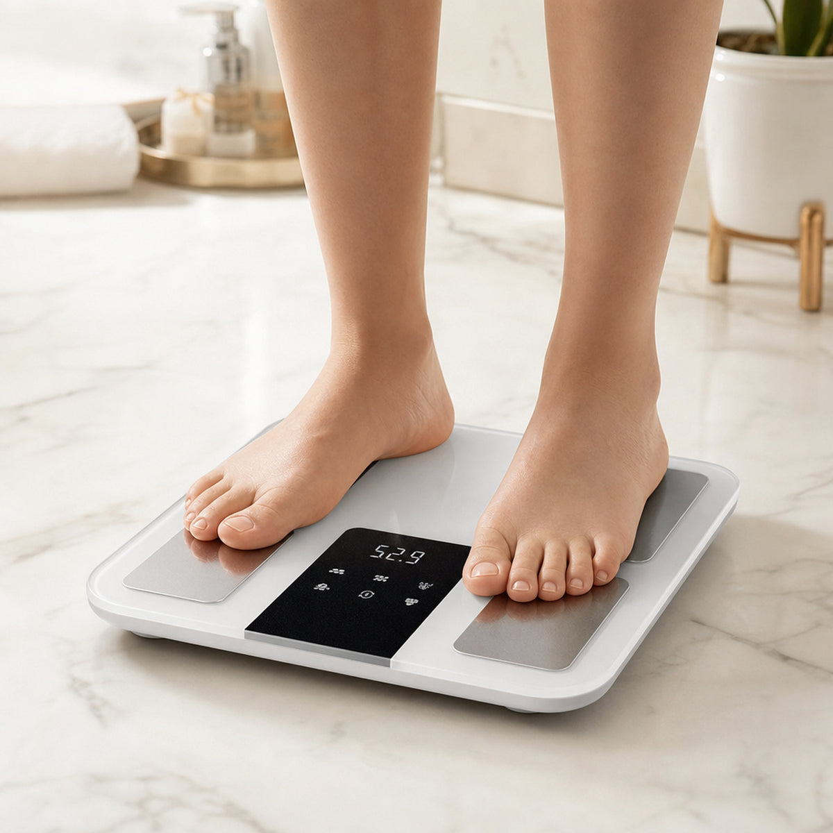 DELTA smart body composition scale – close-up of bare feet stepping onto the scale on a bright bathroom floor